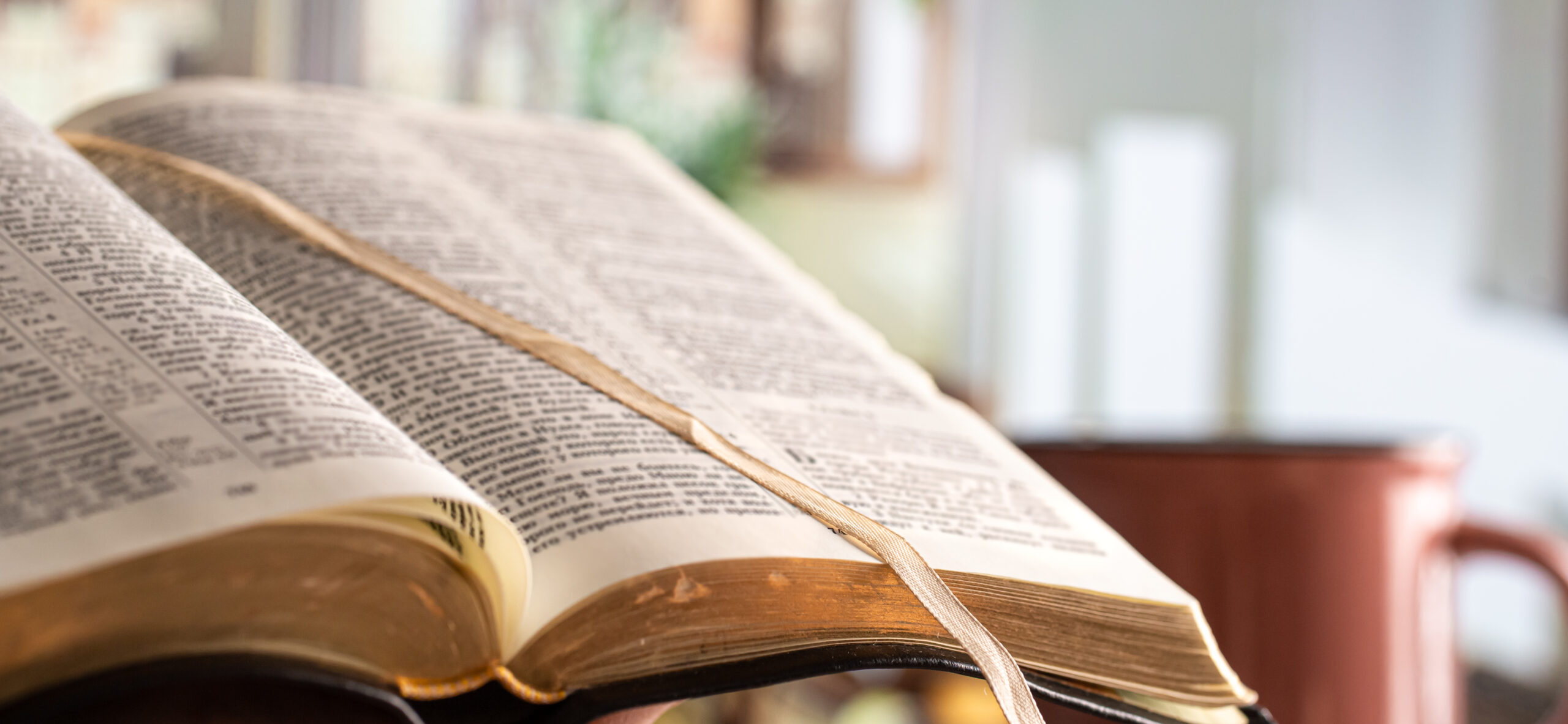 Book Bible close-up, on a beautiful terrace background. Morning time. Space for text.